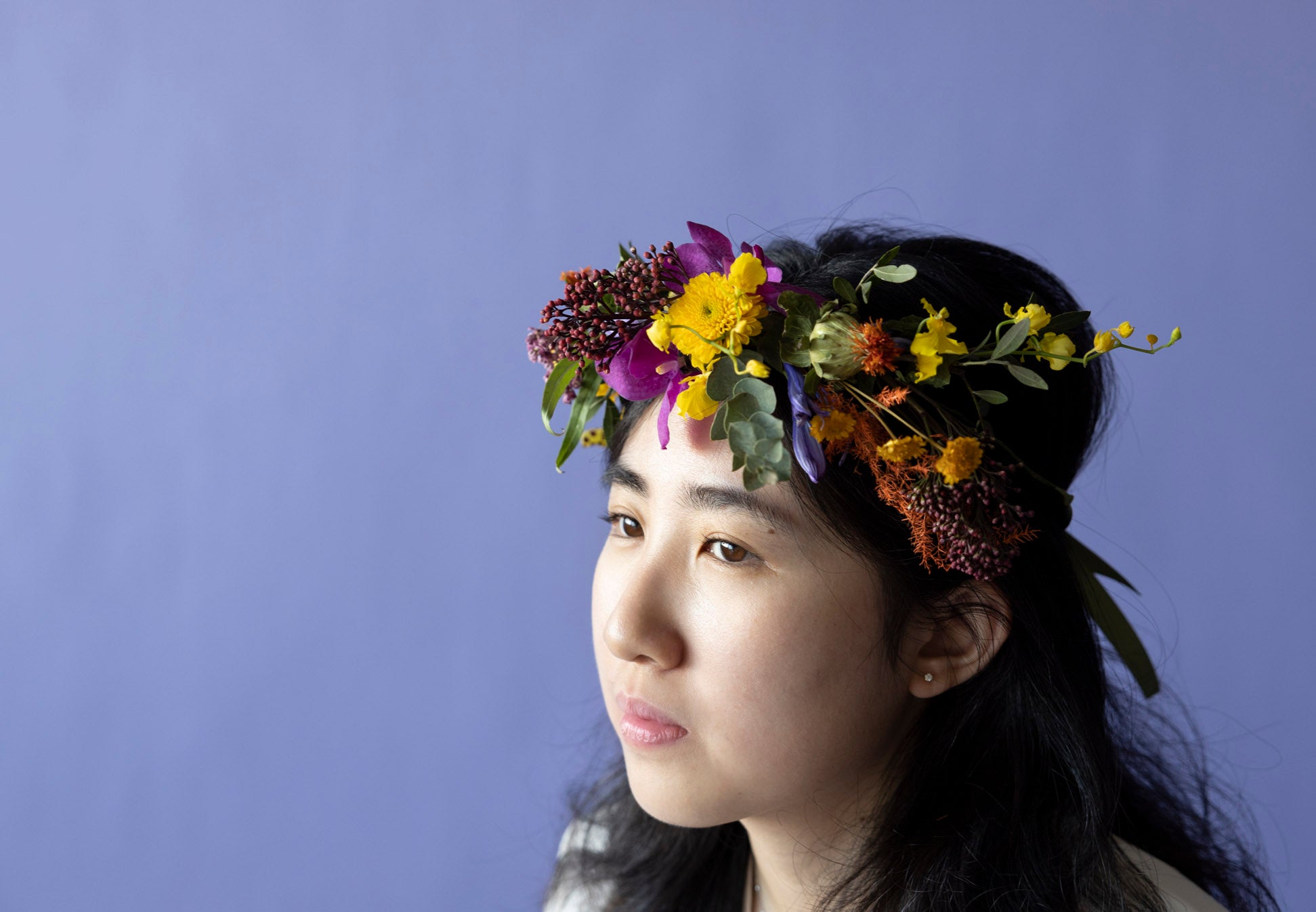 A Lady wear Floral Crown in Hidcote Brights