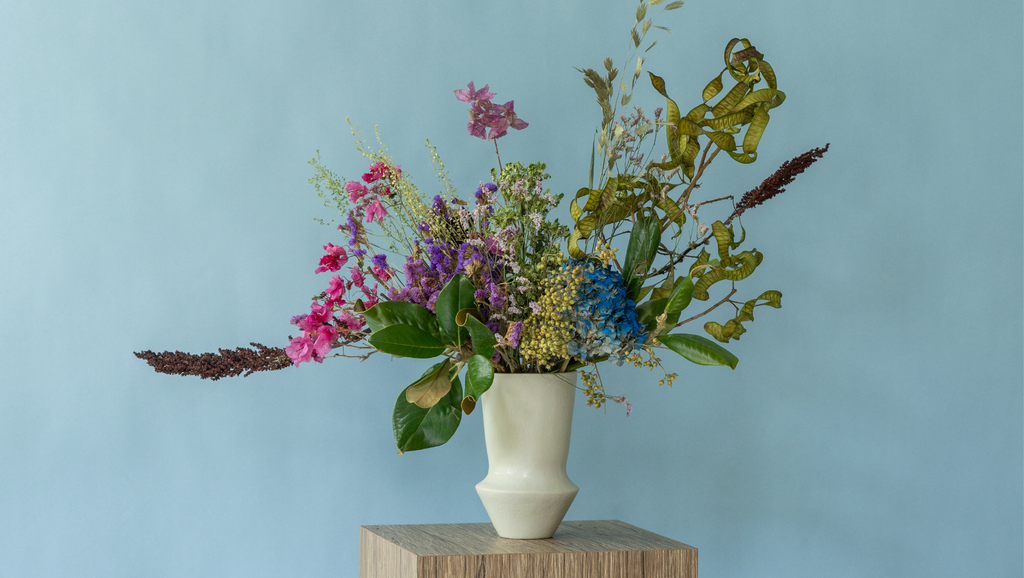 Seasonal dried flower arrangement in a ceramic vase by Charlotte Puxley Flowers Singapore
