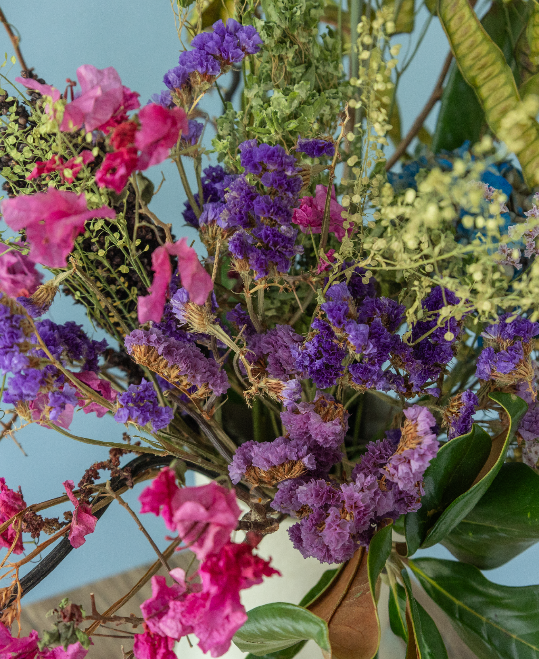 Preserved floral arrangement with natural textures displayed in a ceramic vase from the Charlotte Puxley Flowers Summer Collection