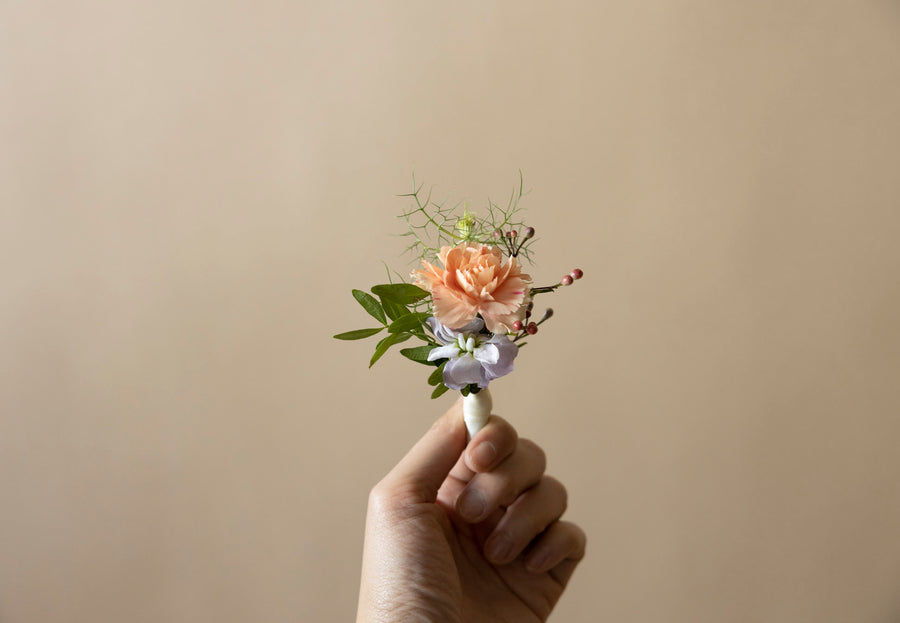 Boutonnière in Great Dixter Pastels for Groom and family members