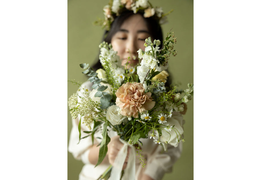 A lady with Bridesmaids' Bouquet in Sissinghurst White