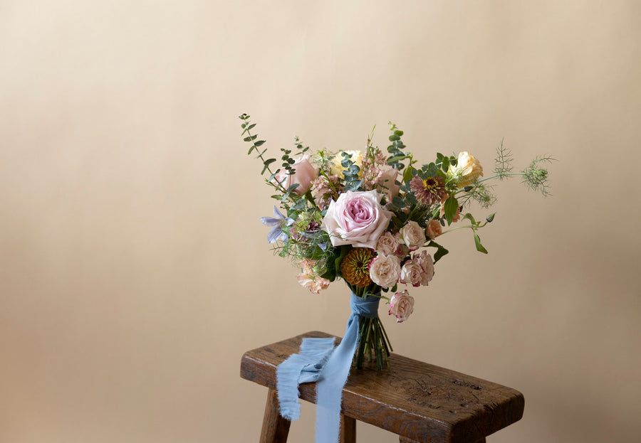 Bridal Bouquet in Great Dixter Pastels on wooden table