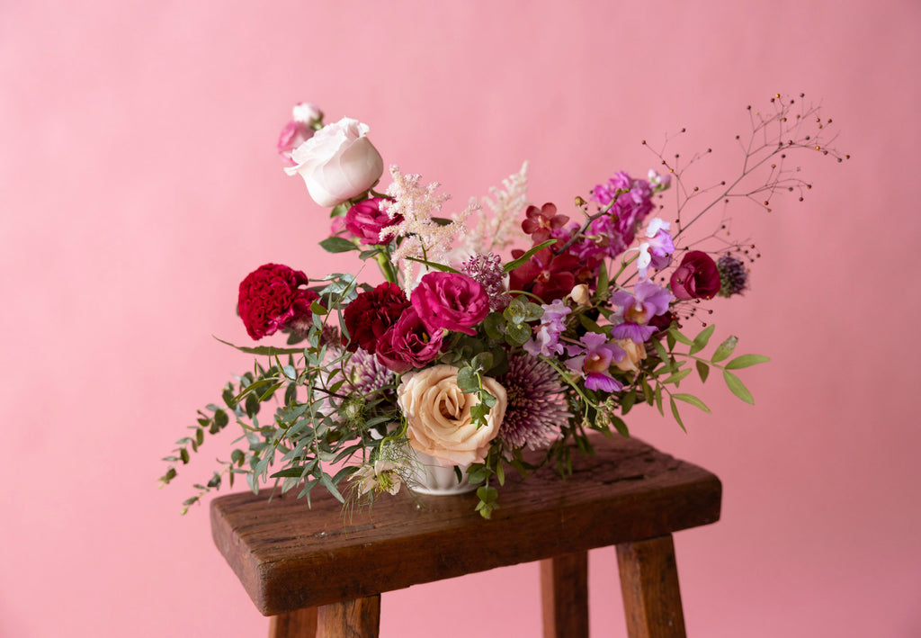 Low Table Centrepiece in Hampton Court Reds by Charlotte Puxley Flowers