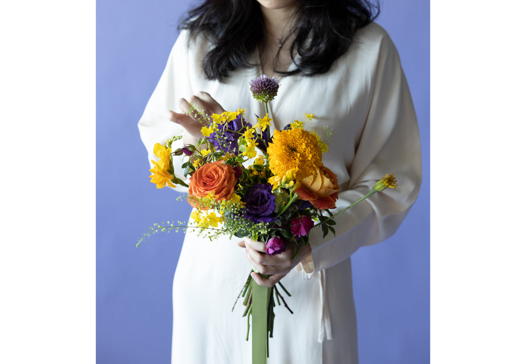 A Lady hold Bridal Bouquet in Hidcote Brights