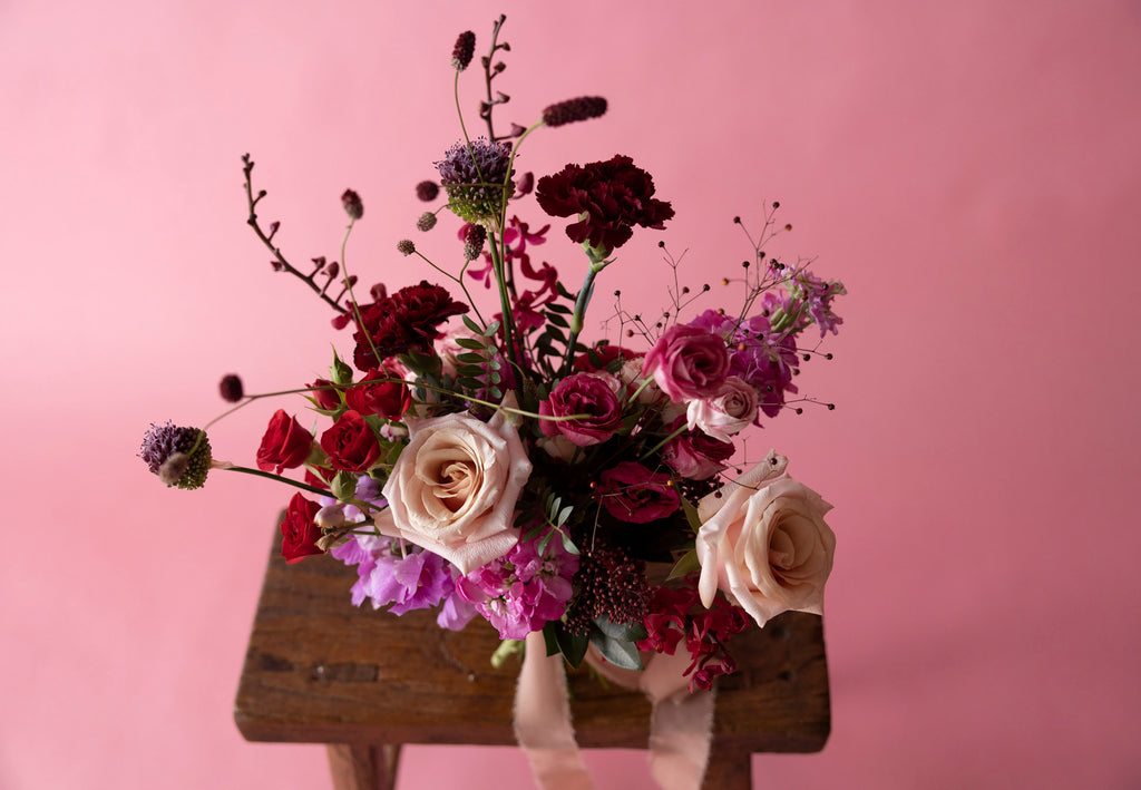 Close-up of Bridal Bouquet in Hampton Court Reds