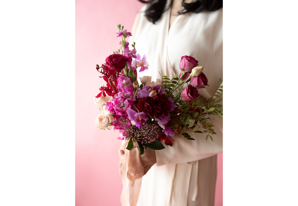A Lady hold Bridesmaids' Bouquet in Hampton Court Reds