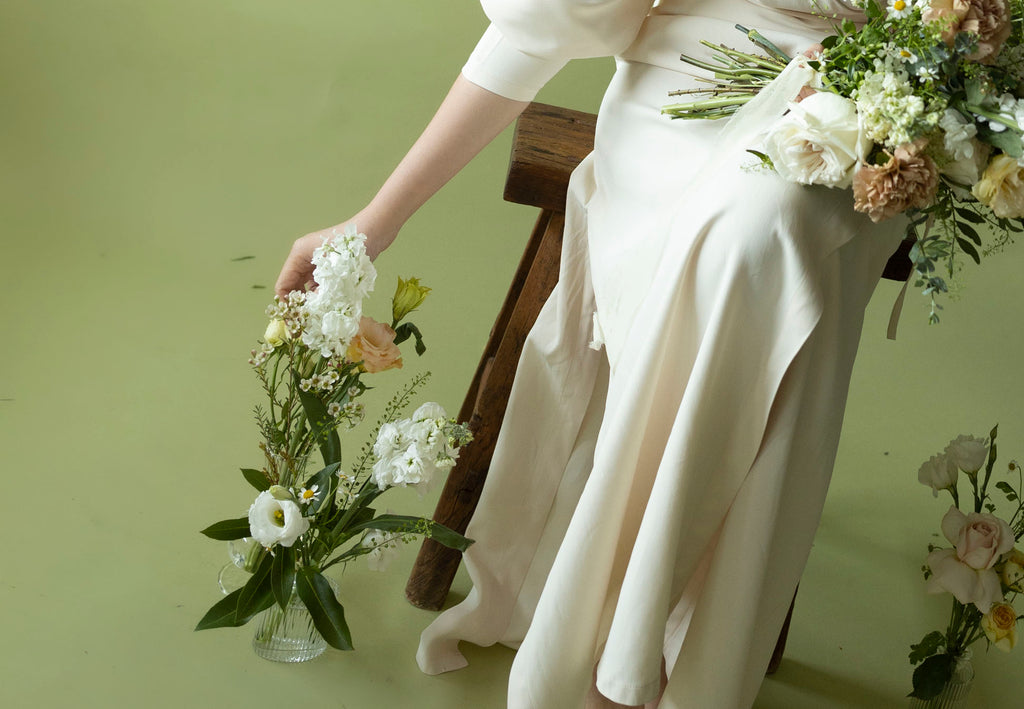 A lady hold Bud Vases in Sissinghurst White