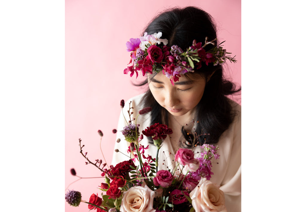 A Lady with Bridal Bouquet and Floral Crown in Hampton Court Reds