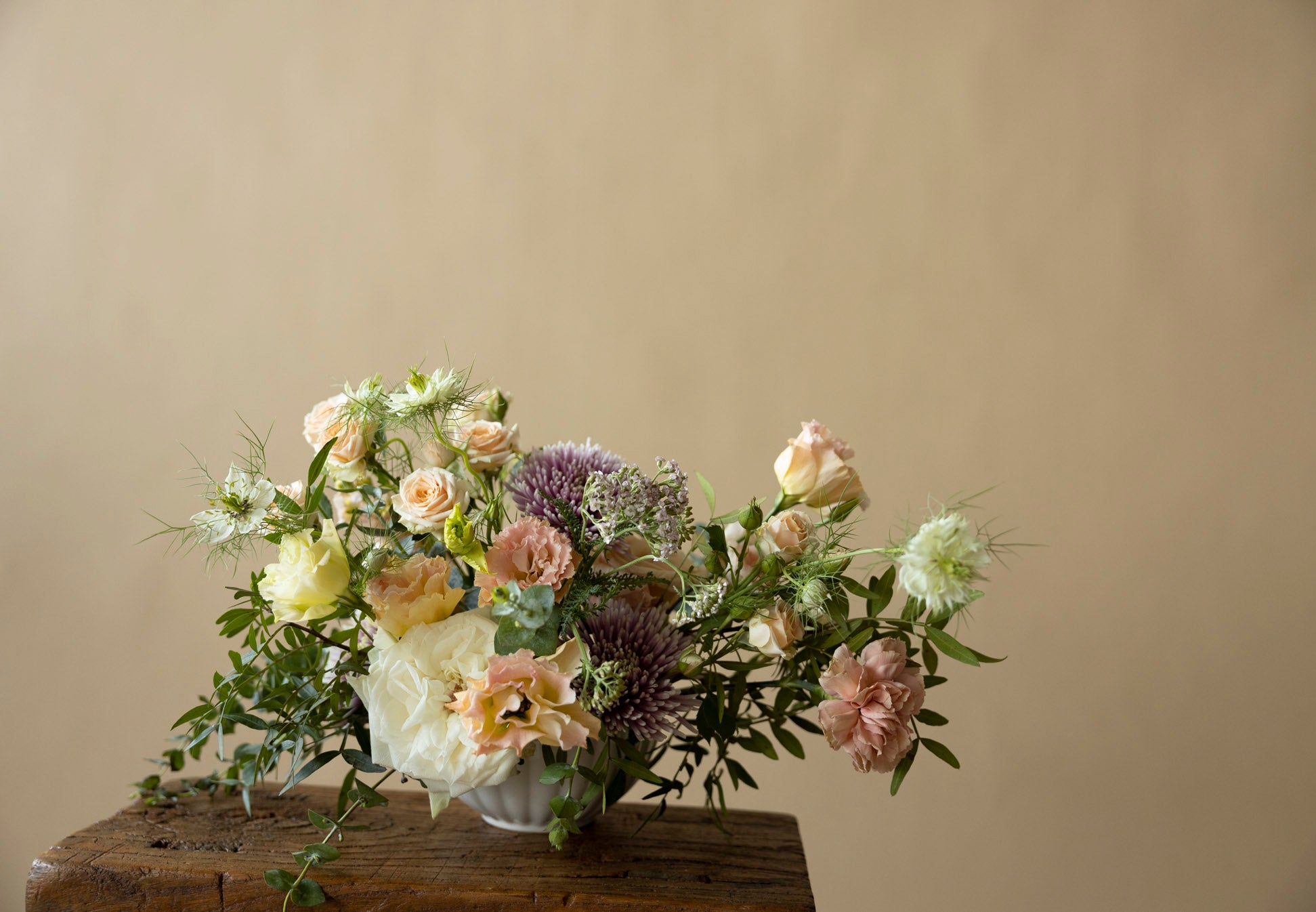 Low Table Centrepiece in Great Dixter Pastel on wooden chair